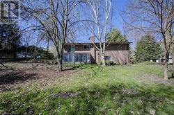 side view of home with glassed in sunroom - 