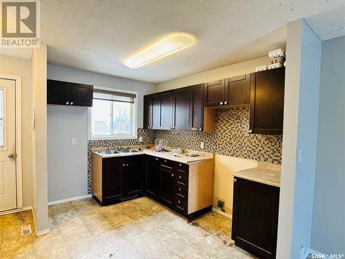 110 521 Dufferin Avenue, Estevan, SK - Indoor Photo Showing Kitchen With Double Sink