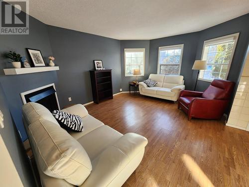 102 106 Mcdermid Drive, Prince George, BC - Indoor Photo Showing Living Room With Fireplace