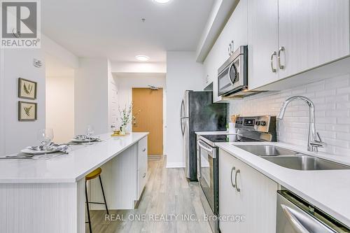 223 - 1105 Leger Way, Milton, ON - Indoor Photo Showing Kitchen With Double Sink With Upgraded Kitchen