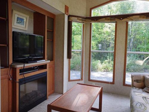 Living room - 1086 Ch. De La Baie-Solitaire, Rouyn-Noranda, QC - Indoor With Fireplace