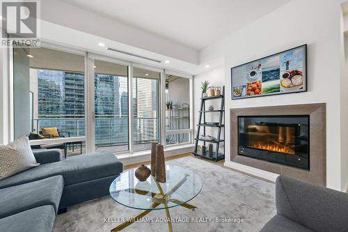 2308 - 180 University Avenue, Toronto, ON - Indoor Photo Showing Living Room With Fireplace