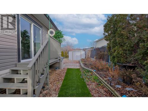 Large sliding doors leading to the private backyard - 3591 Old Vernon Road Unit# 219, Kelowna, BC 