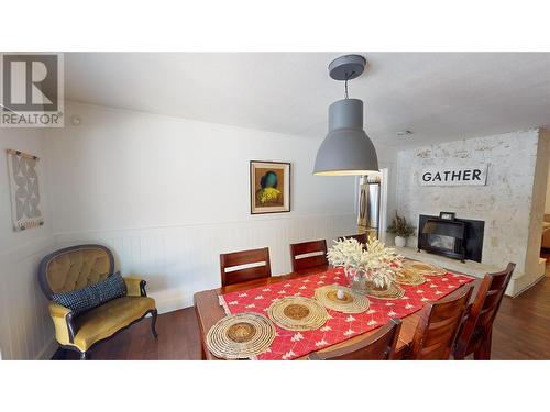 2001 4Th Avenue S, Cranbrook, BC - Indoor Photo Showing Dining Room With Fireplace