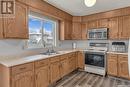 2518 Neff Road E, Regina, SK  - Indoor Photo Showing Kitchen With Double Sink 