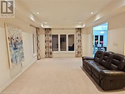 Carpeted living room featuring french doors - 