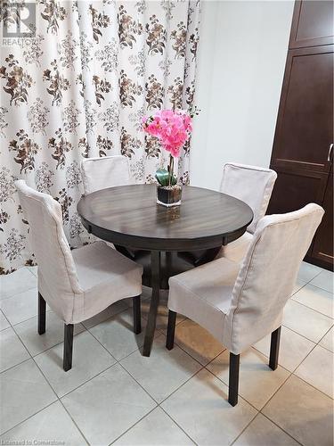 Dining room with light tile patterned flooring - 218 Gravel Ridge Trail, Kitchener, ON - Indoor Photo Showing Dining Room