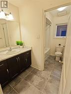 Full bathroom with vanity, toilet, and bathtub / shower combination - 