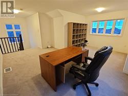 Home office with light carpet - 