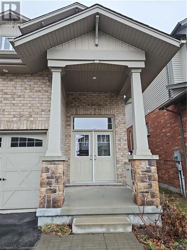 Entrance to property featuring a porch - 218 Gravel Ridge Trail, Kitchener, ON - Outdoor