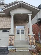 Entrance to property featuring a porch - 