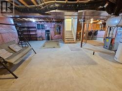 Basement featuring washer and clothes dryer - 