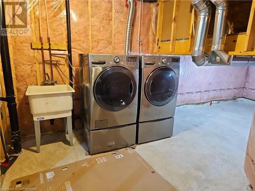 Washroom featuring washing machine and dryer and sink - 218 Gravel Ridge Trail, Kitchener, ON - Indoor Photo Showing Laundry Room