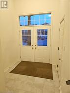 Doorway with light tile patterned floors - 