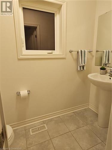 Bathroom featuring tile patterned flooring, toilet, and sink - 218 Gravel Ridge Trail, Kitchener, ON - Indoor Photo Showing Bathroom