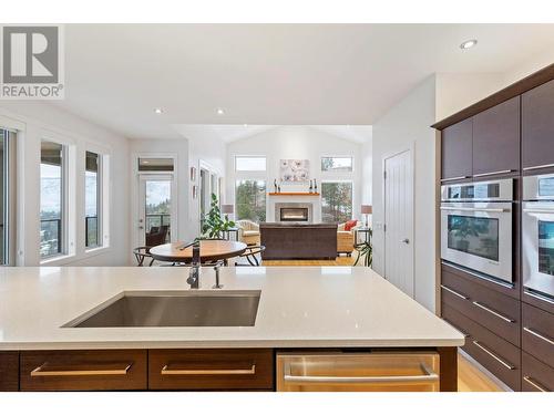 Main Floor - 272 Triple Tree Place, Kelowna, BC - Indoor Photo Showing Kitchen With Fireplace