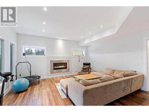 Lower level - 272 Triple Tree Place, Kelowna, BC - Indoor Photo Showing Living Room With Fireplace