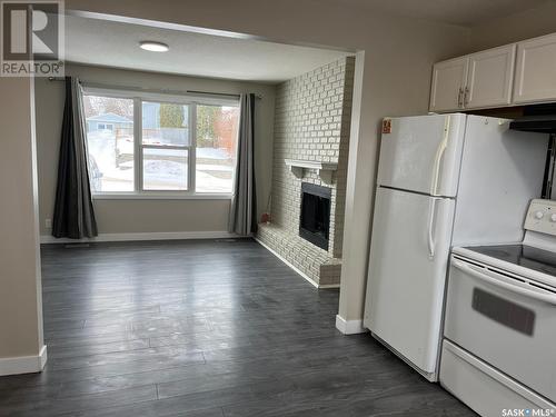 1357 6Th Avenue Nw, Moose Jaw, SK - Indoor Photo Showing Kitchen With Fireplace