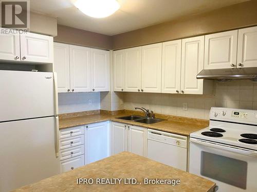 2402 - 3880 Duke Of York Boulevard, Mississauga, ON - Indoor Photo Showing Kitchen With Double Sink