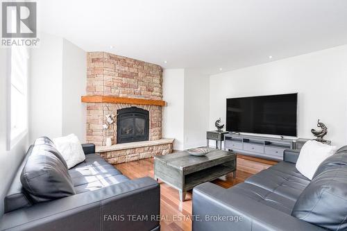 39 Vanderpost Crescent, Essa, ON - Indoor Photo Showing Living Room With Fireplace