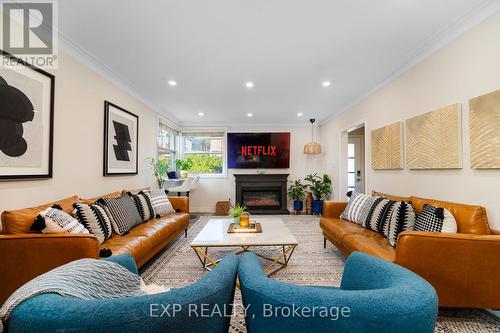 Upper - 54 Stephen Drive E, Toronto, ON - Indoor Photo Showing Living Room With Fireplace