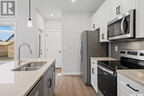 199 Kostiuk Crescent, Saskatoon, SK - Indoor Photo Showing Kitchen With Double Sink