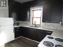 308 6Th Avenue E, Assiniboia, SK  - Indoor Photo Showing Kitchen With Double Sink 