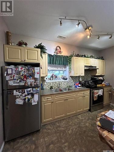 2 1402 4Th Street, Estevan, SK - Indoor Photo Showing Kitchen With Double Sink