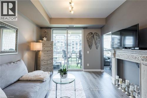 302 - 10 Esplanade Lane, Grimsby, ON - Indoor Photo Showing Living Room With Fireplace