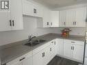 124 Macauley Street, La Ronge, SK  - Indoor Photo Showing Kitchen With Double Sink 