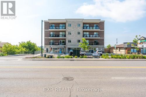 202 - 310 Broadway Avenue, Orangeville, ON - Outdoor With Facade