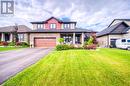 View of front facade featuring a garage and a front lawn - 66 Lock Street, Innerkip, ON  - Outdoor With Facade 