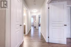 Hallway with wood-type flooring - 