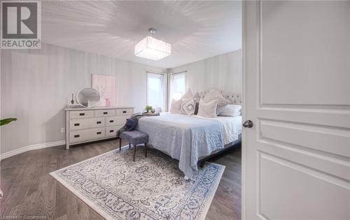 Bedroom with dark wood-type flooring - 66 Lock Street, Innerkip, ON - Indoor Photo Showing Bedroom