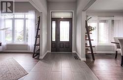 Foyer with wood-type flooring - 