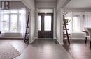 Foyer with wood-type flooring - 66 Lock Street, Innerkip, ON  - Indoor Photo Showing Other Room 