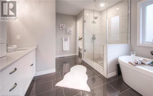 Full bathroom with tile patterned flooring, vanity, separate shower and tub, and toilet - 66 Lock Street, Innerkip, ON - Indoor Photo Showing Bathroom