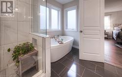 Bathroom featuring a bath and tile patterned floors - 