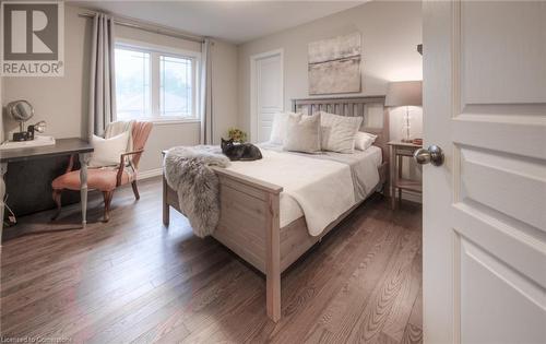 Bedroom featuring dark hardwood / wood-style flooring - 66 Lock Street, Innerkip, ON - Indoor Photo Showing Bedroom