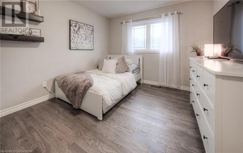 Bedroom with dark hardwood / wood-style flooring - 66 Lock Street, Innerkip, ON - Indoor Photo Showing Bedroom