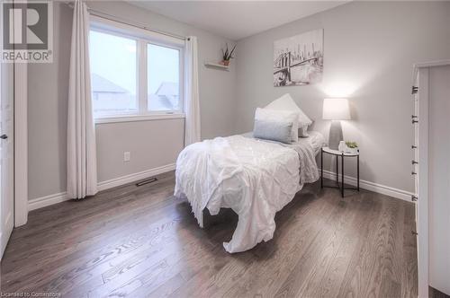 Bedroom with dark hardwood / wood-style floors - 66 Lock Street, Innerkip, ON - Indoor Photo Showing Bedroom