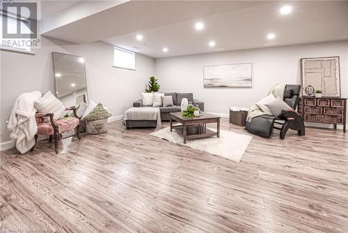 Living room with a healthy amount of sunlight and light wood-type flooring - 66 Lock Street, Innerkip, ON - Indoor Photo Showing Basement