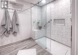 Bathroom featuring a shower with door - 