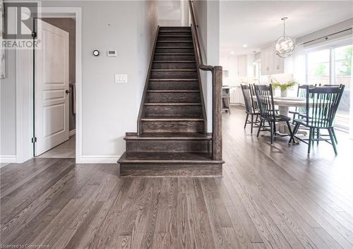 Stairway featuring wood-type flooring - 66 Lock Street, Innerkip, ON - Indoor Photo Showing Dining Room