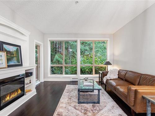 107-631 Brookside Rd, Colwood, BC - Indoor Photo Showing Living Room With Fireplace