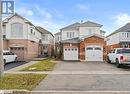 Front facade with a garage - 17 Emslie Street, Halton, ON  - Outdoor With Facade 