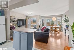 Living room with light wood-type flooring - 