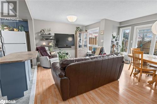 Living room featuring a textured ceiling and light wood-type flooring - 17 Emslie Street, Halton, ON - Indoor Photo Showing Living Room