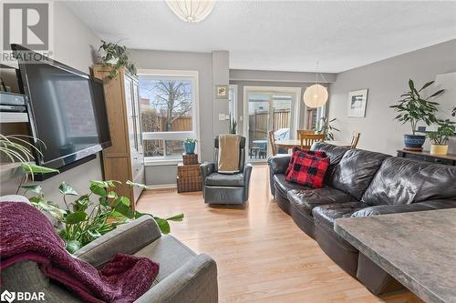 Living room featuring light hardwood / wood-style floors and a textured ceiling - 17 Emslie Street, Halton, ON - Indoor Photo Showing Living Room