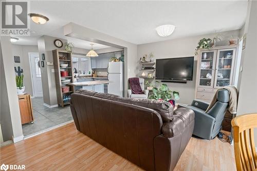 Living room with light wood-type flooring and a textured ceiling - 17 Emslie Street, Halton, ON - Indoor Photo Showing Living Room